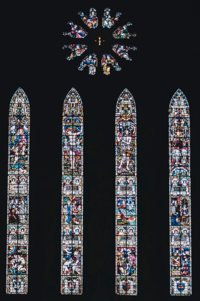 a stained glass window depicting important events in the bible