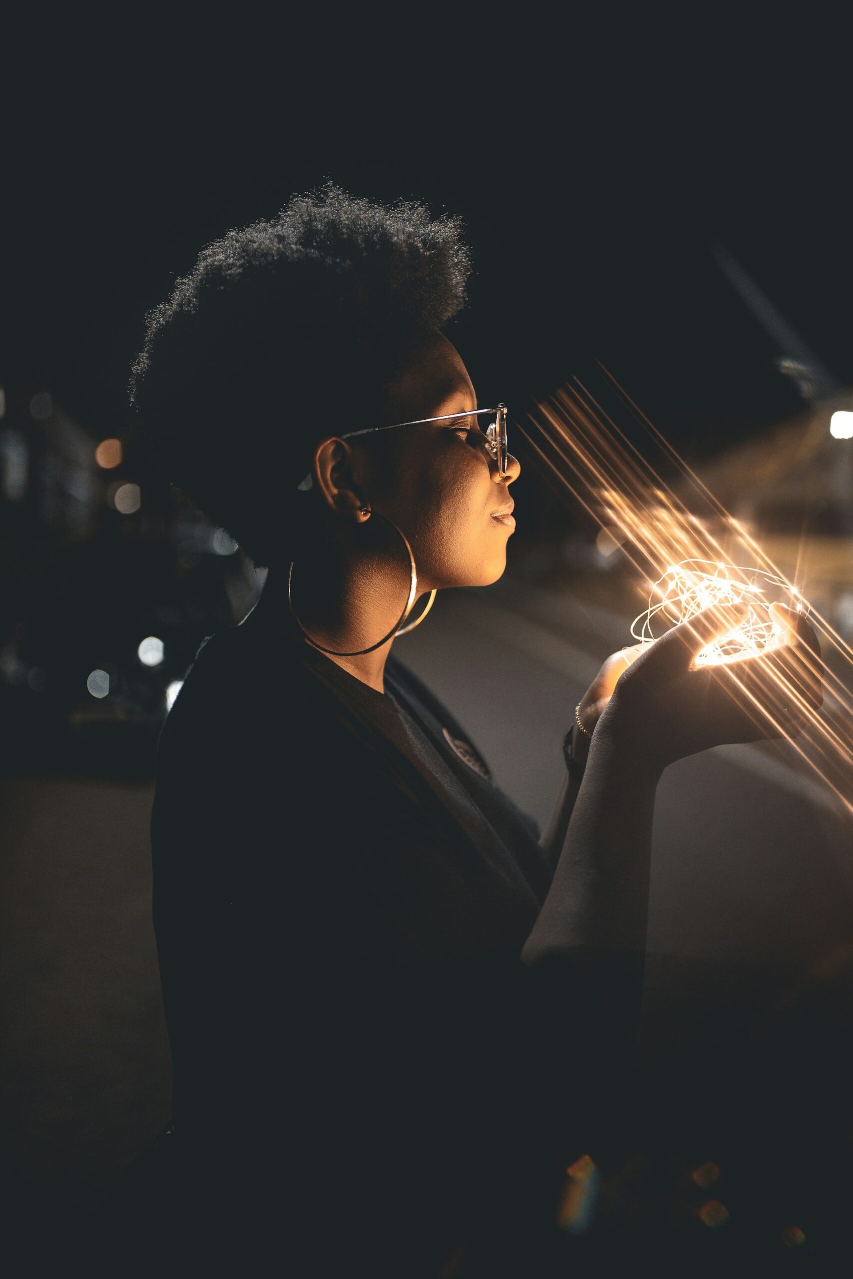 Pure PowerPoint woman touching strings of light